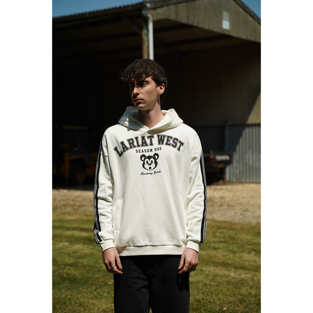 Varsity | Drop-Shoulder Hoodie front view, varsity lockup graphic, collegiate lettering